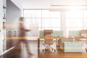 Businessman wearing formal suit is walking inside office