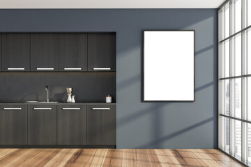 Empty canvas on blue wall of black wood kitchen