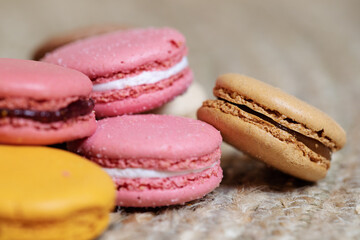 Colorful macaroons on light background