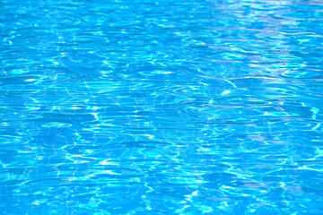 Blue water, close-up pool natural background.