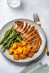 Grilled chicken breast, fillet with sweet potato or pumpkin and green beans, healthy food, top view