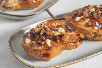 pear and cheese. pear baked with blue cheese, nuts and honey, Delicious balanced food concept. Food recipe background. Close up