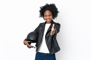 Young African American woman with a motorcycle helmet isolated on white background handshaking after good deal