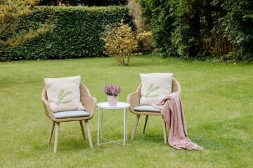 Two chairs in the garden. Relax in the garden. Nice vacation in the country. Heather as decoration. Big garden in Germany 