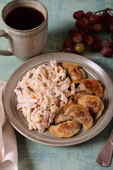 Fried dumplings with meat and salad on a plate