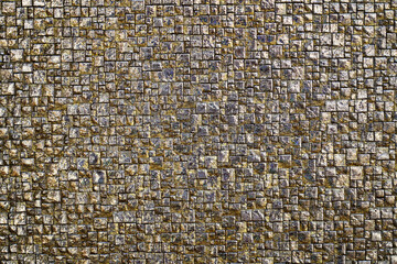Fototapeta premium Brown grey wall of large and small squares, floor with cracks, texture background