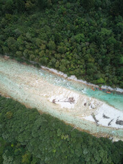 Aerial shot of kayakers in the river Soca in Slovenia.
