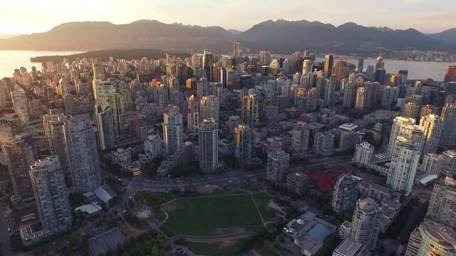4K aerial Vancouver Skyline Sunset global backward view