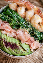 Healthy protein and omega-3 rich lunch bowl with shrimps, close-up