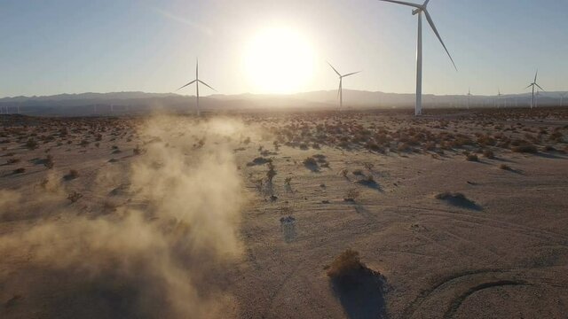 4K Aerial of ATV riding fast through California Desert doing donuts fun at sunset