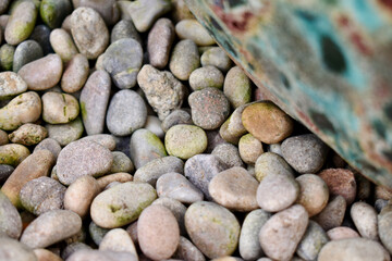Closeup of pebbles and a boulder