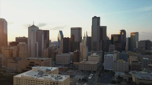 4K Aerial shot of Dallas Skyline downtown at sunset pan move