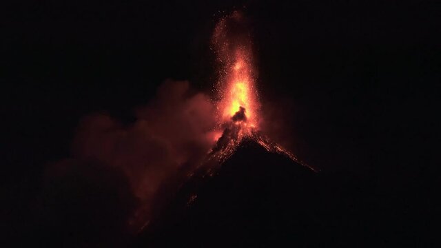 4K Erupting Volcano slowmotion at night with lava in Guatemala