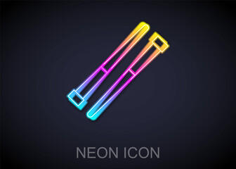 Glowing neon line Food chopsticks icon isolated on black background. Wooden Korean sticks for Asian dishes. Oriental utensils. Vector
