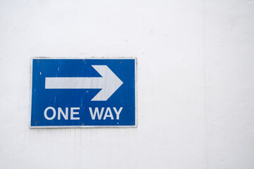 One way right arrow sign. White on blue background