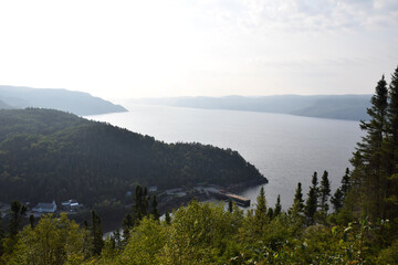 Sainte-Rose-du-Nord, Quebec, Canada: Top view of beautiful Canadian fjord side village with mountains and trees, north of the Saguenay Fjord, during the morning
