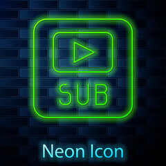 Glowing neon line Video with subtitles icon isolated on brick wall background. Vector