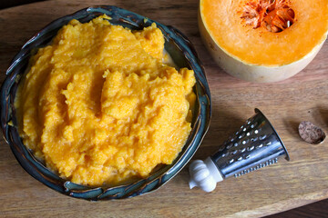 Butternut squash puree on a wooden board.