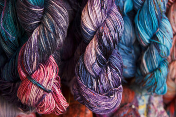 Cotton yarn. Hand-dyed threads. Modern tie dye. Diversified skeins for knitting