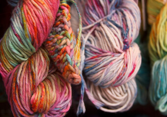 Multicolored cotton yarn for knitting. Hand-dyed threads. Modern tie dye on the thread skein