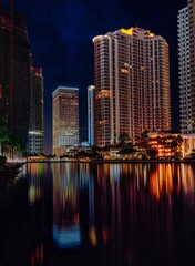 Fototapeta na wymiar Miami Florida country skyline at night buildings skyscrapers sea reflections urban bay 