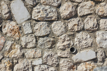 Empty,stone wall with drain pipe,backgrounds
