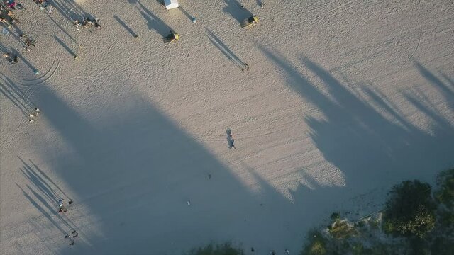 4K Epic Aerial Miami South Beach flying over people rotation
