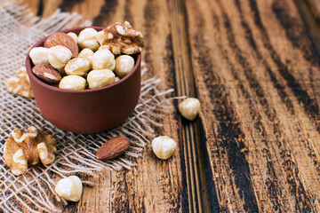 nuts in an earthen bowl on the table