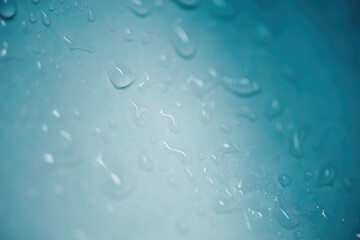 Blue surface with water droplets concept background