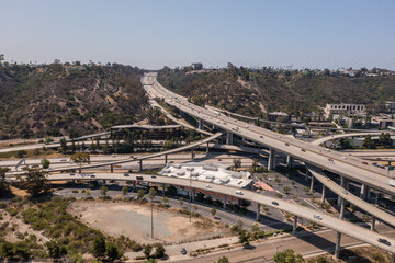 Commuters drive on San Diego Freeways. Busy California highways, aerial.