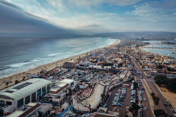 Aerial view of amusement park in Mission Beach. Pacific Beach in distance. 