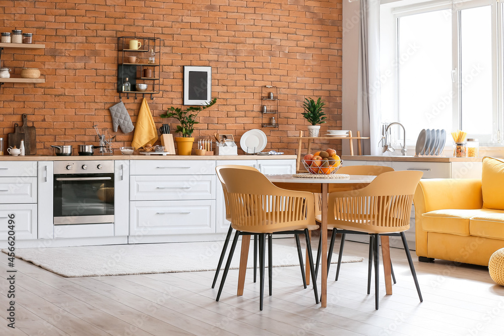 Wall mural dining table with fresh fruits in modern kitchen