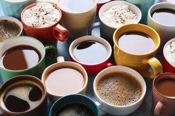Cups of tasty coffee on color background