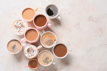 Obraz na płótnie Canvas Cups of tasty coffee on light background