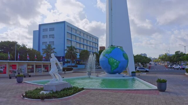 Monument to Heroes in Santo Domingo, with statue in front of fountain, globe