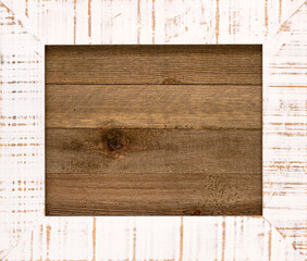 Vintage wooden frame on top of a wood board with copy space.