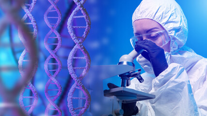 Molecular genetics. Laboratory assistant in white protective suit looks at DNA molecule. Microscope...