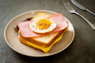 bread toasted cheese topped ham and fried egg with pork sausage
