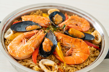 Seafood Paella with prawns, clams, mussels on saffron rice