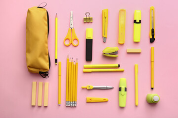 Composition with pencil case and stationery on color background