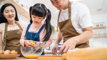Asian happy family stay home in kitchen bake bakery and food with kid. 