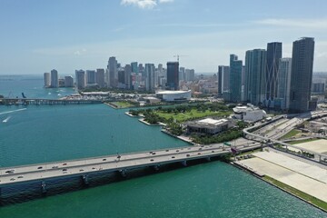 Aerial view of MacArthur Causeway and City of Miami, Florida skyline on sunny summer afternoon.