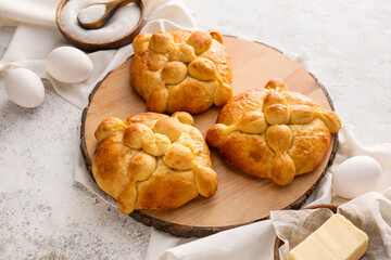 Board with bread of the dead and ingredients on grunge background. Celebration of Mexico's Day of the Dead (El Dia de Muertos)