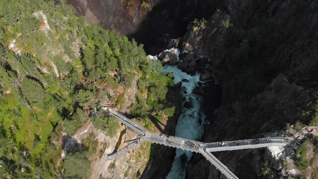 Overhead view of tourists crossing new bridge at Voringsfossen falls, Norway