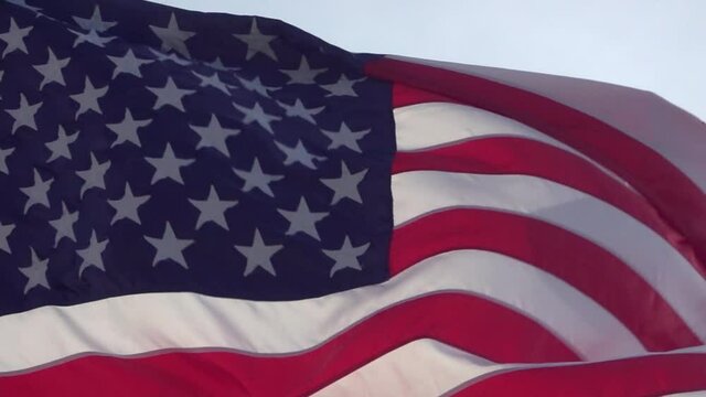 American flag waving in the wind. Close up, tight frame.