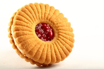 Fresh baked jam biscuits on a white background. 