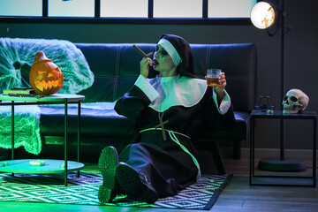 Woman dressed for Halloween as nun with alcohol and cigar in decorated room