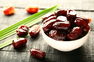 Delicious Arabian organic dates fruits on a rustic background. 