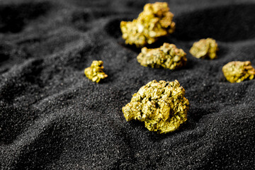 Pure gold from the mine that was unearthed was placed on the black sand.