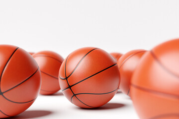 3d illustration of basketball balls. A lot of orange basketball balls lie on a white isolated background. Realistic render with sport swords